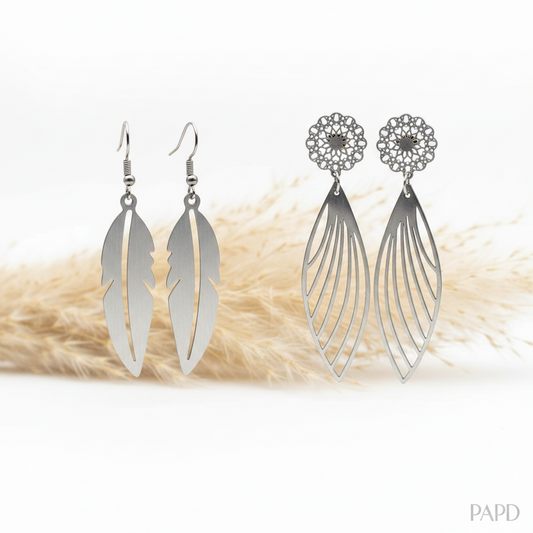 Boucles d’oreilles pendantes plumes ajourées, finition argentée